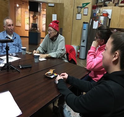 A group of people sitting at a tableDescription automatically generated